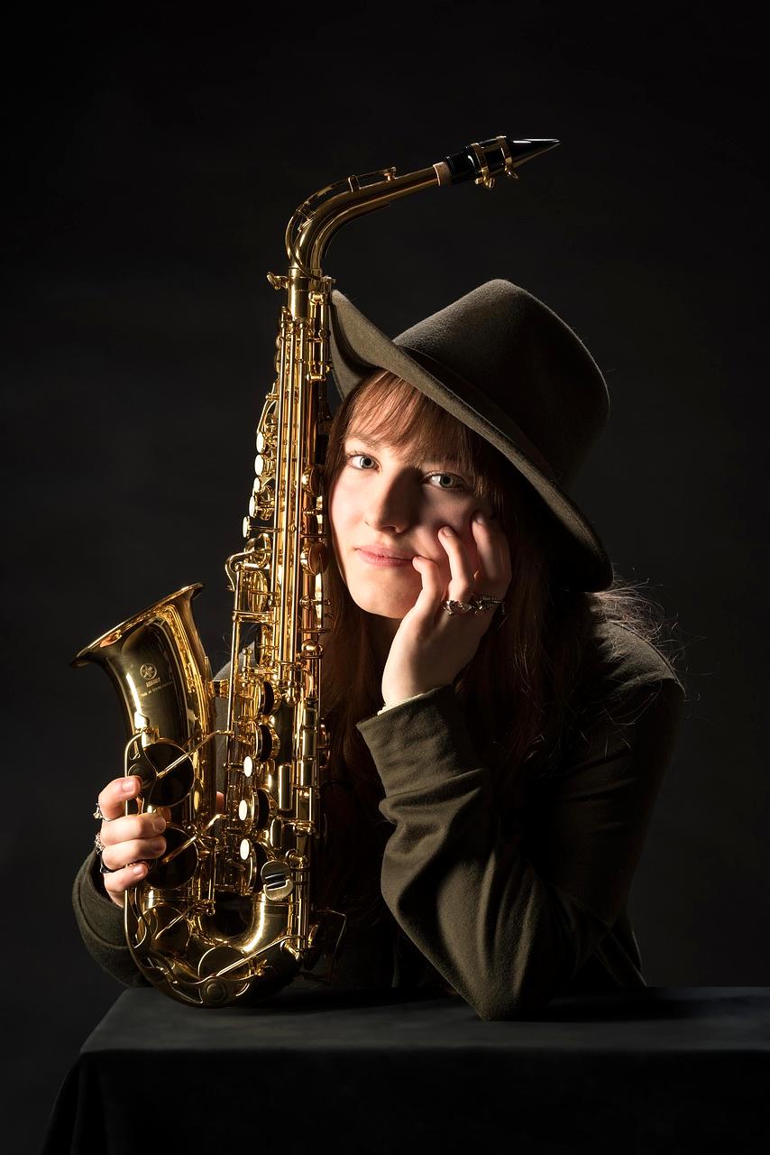 Four-piece jazz ensemble with saxophone, piano, bass and drums on stage