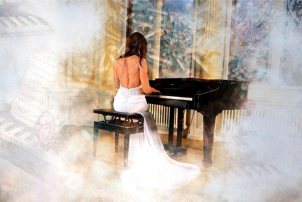 Sophia Martinez playing grand piano in elegant concert hall