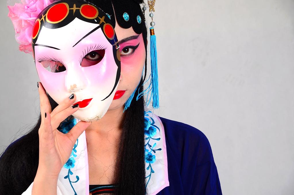 Grand baroque opera house interior with ornate golden details and crystal chandeliers